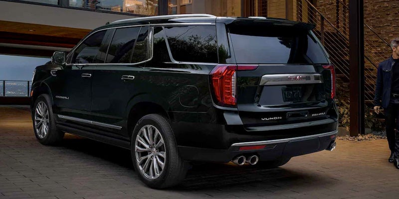 GMC Yukon parked front of house rear view