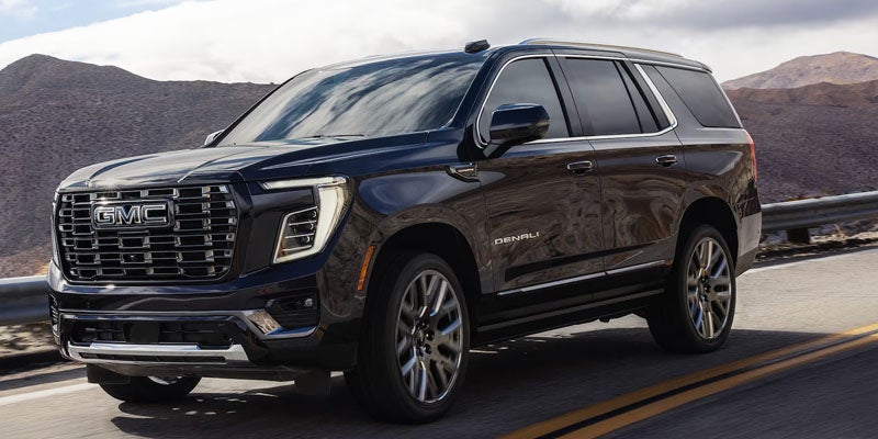 2026 GMC Yukon Denali driving on the highway
